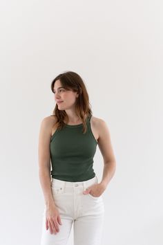 "Best ribbed green tank. Super soft cotton. Flattering Shape. This is our standard Verona overdyed to a Eucalyptus Green. We love this color! Also super cute when cropped. **Stitching is either Eucalyptus or a brighter green as shown. Let us know your preference in order notes. Maker: Military  |  Material: 100% cotton stretches Condition: Excellent. Washed Deadstock. OR IMPERFECT - Small Marker-tip size spots/ sun spots  X-SMALL Chest: 10-11\" unstretched |  Length: 25\" SMALL: Chest: 12-13\" u Rib Knit Tank Top, Eucalyptus Green, Top Base, Cute Tank Tops, Knit Tank Top, Green Tank, Green Vintage, Knit Tank, Style Expert