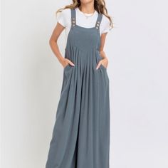 Elevate Your Fashion Game With Our Adjustable Strap Overall Wide Leg Jumpsuit, Designed To Offer Both Style And Comfort. This Versatile Piece Is Perfect For Creating A Chic, Laid-Back Look. Key Features: Fabric: Made From A Blend Of 70% Rayon And 30% Linen, Combining A Soft, Breathable Feel With Durability. Fit: Slouchy Silhouette With Wide Legs For A Relaxed And Modern Look. Color Options: Available In Slate Grey. Sizes: Offered In A Range Of Sizes From S To L To Accommodate Different Body Shap Shapes Design, Slate Grey, Wide Legs, Wide Leg Jumpsuit, Fashion Games, Body Shapes, Pant Jumpsuit, Color Options, Jumpsuit Romper