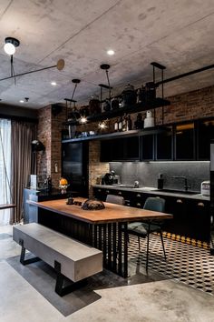 a kitchen with black and white checkered flooring, an island bench and open shelving