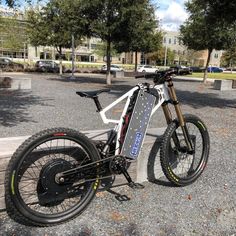 an electric bike parked on the side of a road