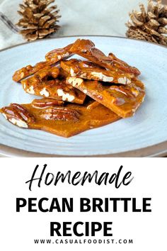 homemade pecan brittle recipe on a white plate with pine cones and text overlay