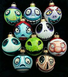 a bunch of different colored ornaments with eyes and mouths on each one ornament