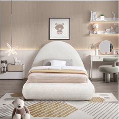 a white bed sitting on top of a wooden floor