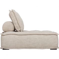 an upholstered chaise lounge with two pillows on it's backrest