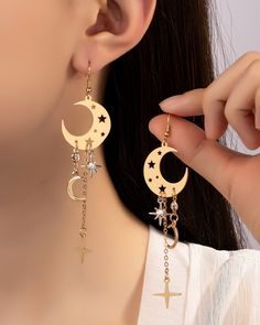 Moon and star charms earrings. Size: 4.0" Celestial Style Drop Earrings With Dangling Charms, Trendy Moon Charm Drop Earrings, Celestial Moon Earrings With Star Charm, Celestial Moon Shaped Earrings With Star Charm, Celestial Moon-shaped Earrings With Star Charm, Trendy Dangle Earrings With Moon Charm, Star-shaped Moon Charm Earrings For Party, Moon Charm Star Shaped Party Earrings, Party Earrings With Moon And Star Charms