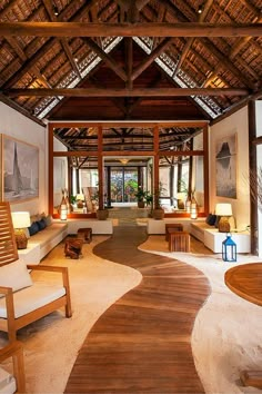 the inside of a house with wooden floors and ceilings