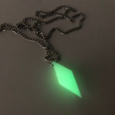 a necklace with a green glow on it