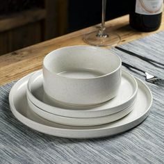 a table with plates and wine glasses on it