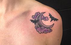 a half moon and bats tattoo on the chest