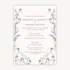 a wedding card with flowers and leaves on the front, in pastel blue tones