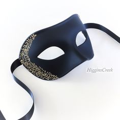 "Elegant Mens Masquerade mask, Custom Mens venetian mask, Black tie Masquerade Ball, Halloween Mens Mask, Black with Gold Mask MORE COLORS Simple and elegant Black Masquerade Masks for Men. The masks can be colored in a variety of shimmers. Picture shown has black with shimmer (Light Gold Shown, Other colors available). S H I P P I N G - Last minute masquerade mask shopping? Processed same day or within 24 hours. 1-2 day guaranteed delivery services offered, add items to cart and click on shippi Black And Gold Masquerade Mask Stick, Black Formal Eye Mask Masquerade, Formal Black Eye Mask, Black Formal Eye Mask, Elegant Black Formal Mask, Black Formal Masquerade Mask For Halloween, Venetian Formal Eye Mask, Venetian Masquerade Mask For Halloween Formal, Black Venetian Masquerade Mask