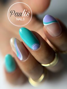 a woman's hand with blue and white nail polish