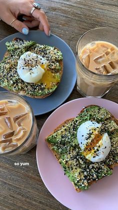 two pieces of toast with an egg on top and some coffee in the background next to it