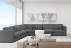 a modern living room with gray couches and white walls