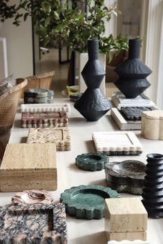 several vases and other decorative items on a table