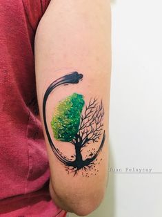 a woman with a tree tattoo on her arm