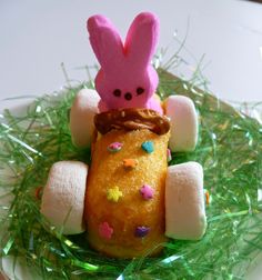 a bunny car made out of doughnuts and sprinkles on grass