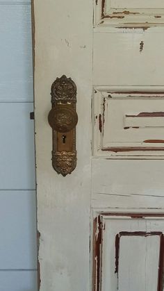 an old door with a metal handle on it