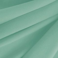 a close up shot of the fabric in mint green color, which is very soft