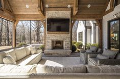 a living room with couches and a fireplace