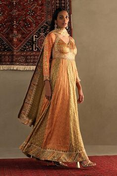 Orange two tone floor length anarkali featuring all over contrast bandhani prints and bindiya embroidery. Paired with a churidar and a floral embroidered dupatta., Fit: Relaxed Bandhani Anarkali, Printed Anarkali Dress, Orange Anarkali, Anarkali Churidar, Floor Length Anarkali, Bandhani Print, Printed Anarkali, Ritu Kumar, Embroidered Dupatta