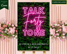 a neon sign that says talk forty to me in front of pink flowers and greenery