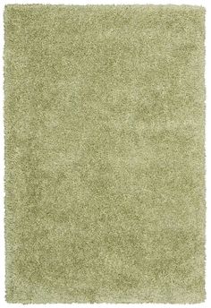 a green rug on a white background with no one in the room to see it