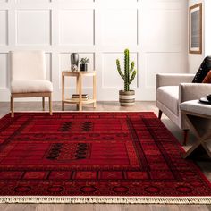 a living room with two chairs and a rug