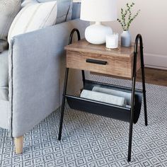 a living room with a couch, table and lamp