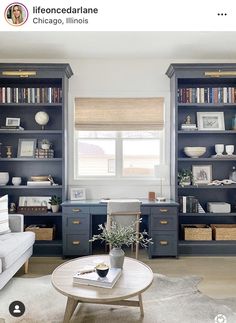 a living room filled with furniture and bookshelves