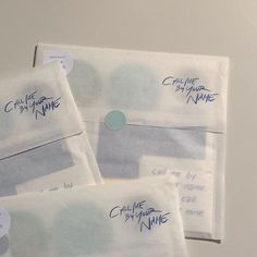 four envelopes with writing on them sitting next to each other