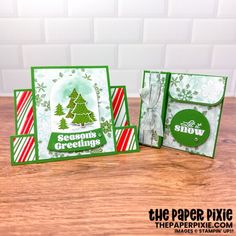 three christmas cards on a table with the words, snow and evergreen greetings in green