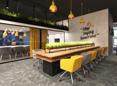 an office with yellow chairs and green plants on the table in front of it,