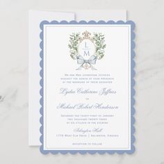 a wedding card with the letter l on it and an image of a wreath in the middle