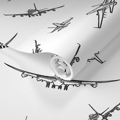 an airplane wallpaper with black and white airplanes on the paper, as well as other planes