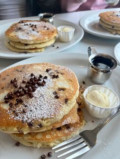 pancakes with powdered sugar and chocolate chips on them