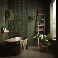 a bath tub sitting next to a window in a green tiled bathroom with plants on the wall