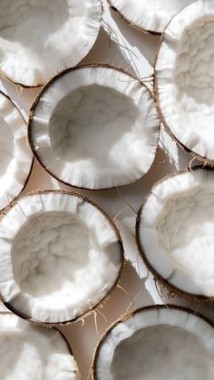 coconut shell bowls are lined up on the table