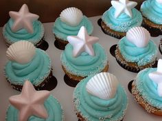 cupcakes decorated with blue frosting and white stars