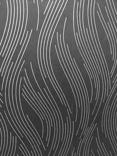 a black and white wall with wavy lines on it