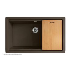 the black sink has a wooden cutting board in it