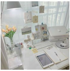 a white desk topped with a laptop computer