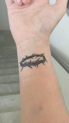 a person with a tattoo on their wrist