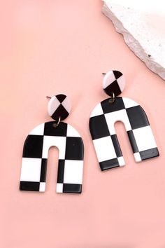 The "Acrylic Checker U Shape Earrings" are a contemporary and playful accessory that effortlessly combines style with a touch of whimsy. The U-shaped design, crafted from vibrant acrylic material, features a playful checker pattern, adding a pop of color and modern flair to your look.DIMENSION length: 2"width: 1.5" earring back: Postmetal finish: gold, rhodium Platingproduct: Lead & Nickel Compliantanti-tarnish: Double E-coating Checker Earrings, Checker Pattern, Post Metal, Sunglass Chain, 90s Aesthetic, Faux Leather Belts, Steel Necklace, Color Calibration, Checkered Pattern