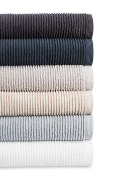 stack of folded towels on white background