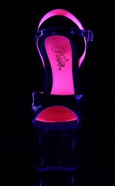 Black patent ankle-strap pole-dancing shoes with an elegant 7-inch stiletto heel and 2 3/4-inch shiny platform with a blacklight-reactive neon pink underside. The SKY series by Pleaser features a contrasting coloured underside, creating a very chic look. Vegan 7-inch Heel 2 3/4-inch Platform Buckled Ankle Strap Women's U.S sizing - refer to size chart for more info Pink Platform Heels, 7 Inch Heels, Hot Pink Heels, Pleaser Shoes, Dancing Shoes, Black Neon, Pink Heels, Pole Dancing, Black Light