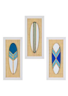 three framed surfboards with blue and white stripes on them, one in the shape of a shield