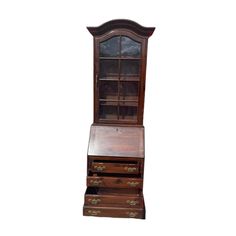 an old wooden desk with drawers and a glass door on the top, against a white background