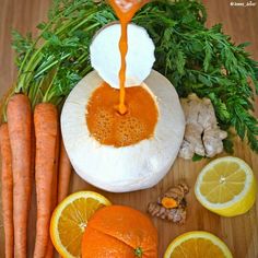 carrots, lemons and garlic are being drizzled with orange juice