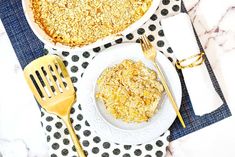 two plates with oatmeal and spoons next to each other on a table